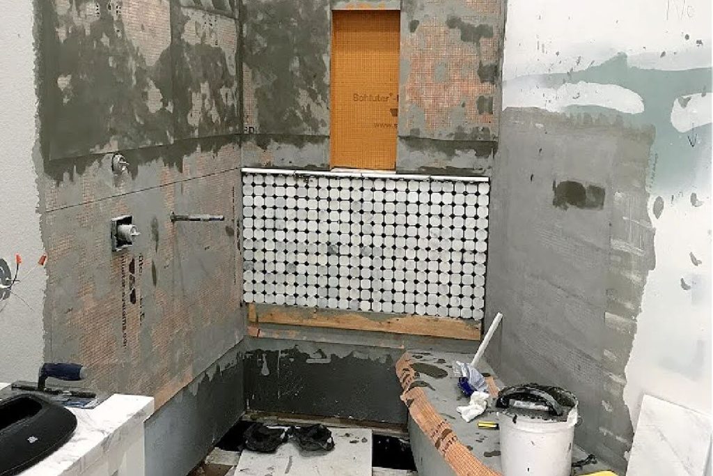 tiling bottom portion of shower walls